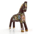 A dark red horse with a "bouquet"