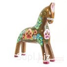 A dun horse with primroses and bells