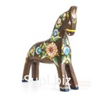 A dun horse with a berry and flower arrangement