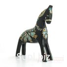 A black horse with a blue and gold pattern